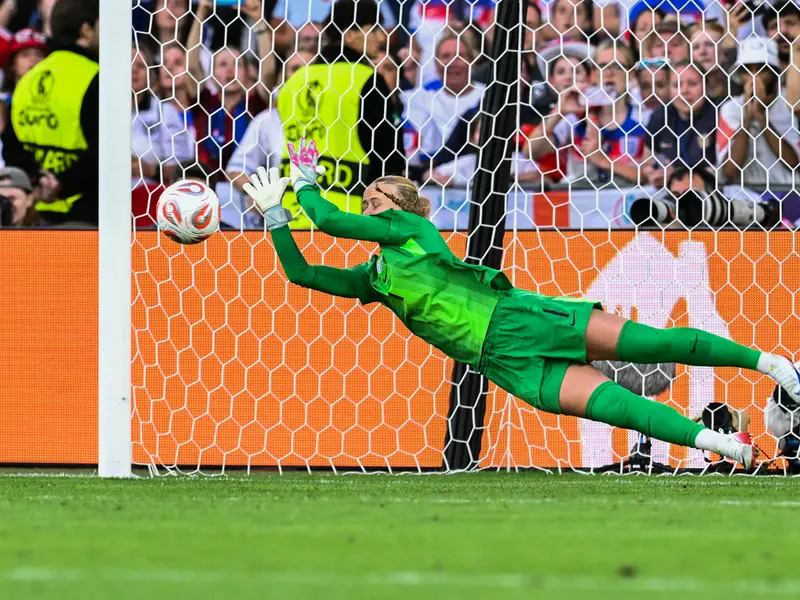 England goalkeeper Hannah Hampton saves a penalty during Euro 2025 final shootout against Spain