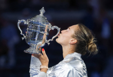 Aryna Sabalenka celebrating with trophy after winning Grand Slam title