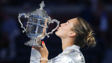 Aryna Sabalenka celebrating with trophy after winning Grand Slam title
