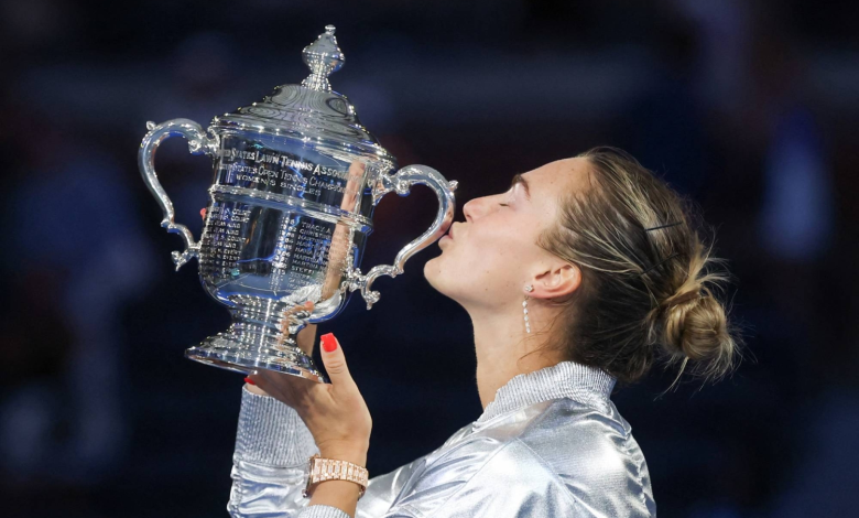 Aryna Sabalenka celebrating with trophy after winning Grand Slam title
