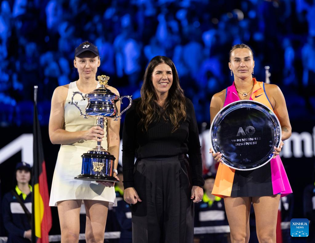 Elena Rybakina and Aryna Sabalenka posing with trophies after Grand Slam final