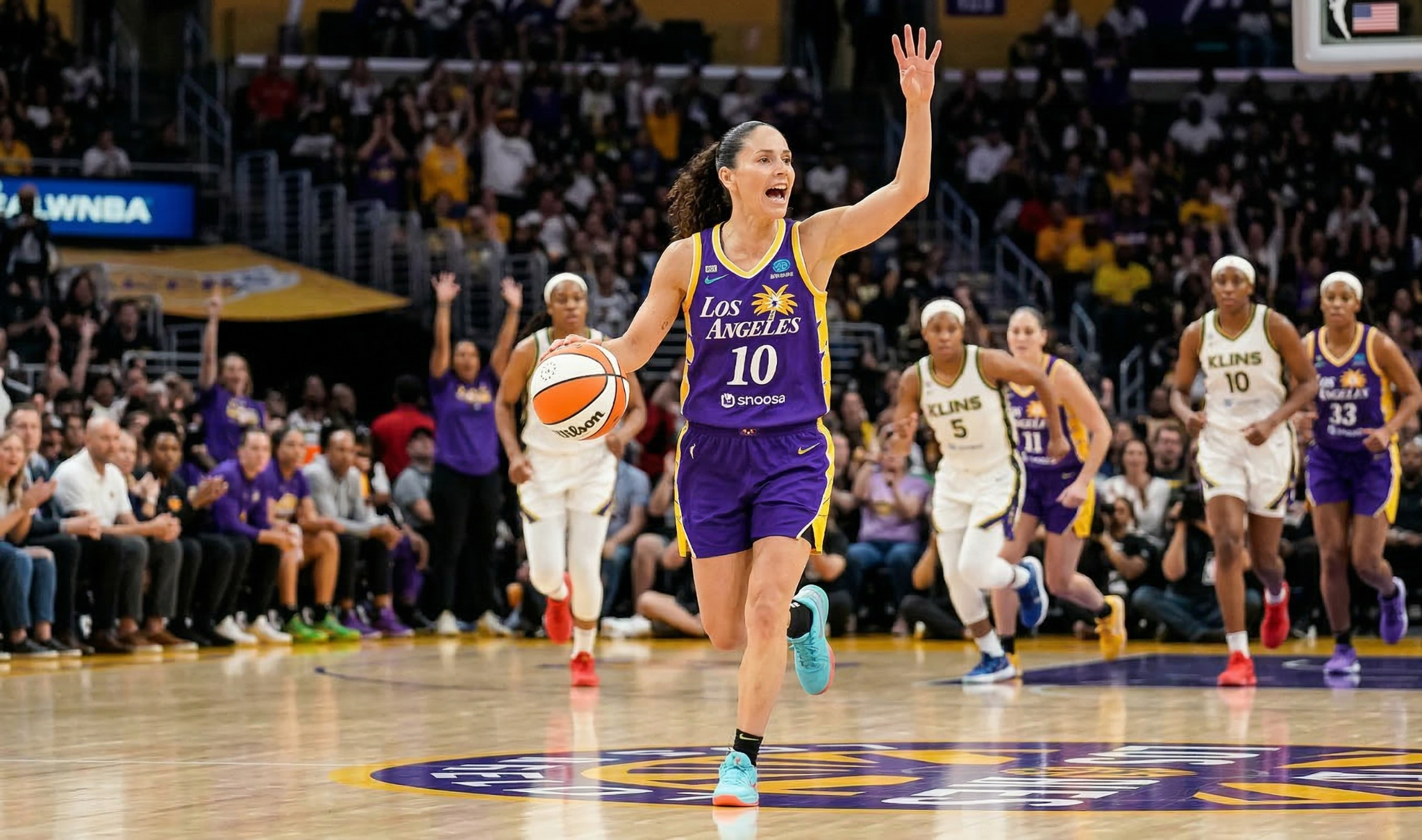 Professional women's basketball point guard demonstrating court vision and passing during game action