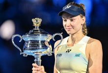Kazakhstan's Elena Rybakina holds the Daphne Akhurst Memorial Cup after her victory against Belarus' Aryna Sabalenka during the women's singles final match on day fourteen of the Australian Open tennis tournament in Melbourne on January 31, 2026. (Photo by Izhar KHAN / AFP) / --