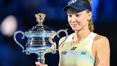 Kazakhstan's Elena Rybakina holds the Daphne Akhurst Memorial Cup after her victory against Belarus' Aryna Sabalenka during the women's singles final match on day fourteen of the Australian Open tennis tournament in Melbourne on January 31, 2026. (Photo by Izhar KHAN / AFP) / --
