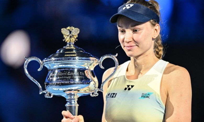 Kazakhstan's Elena Rybakina holds the Daphne Akhurst Memorial Cup after her victory against Belarus' Aryna Sabalenka during the women's singles final match on day fourteen of the Australian Open tennis tournament in Melbourne on January 31, 2026. (Photo by Izhar KHAN / AFP) / --