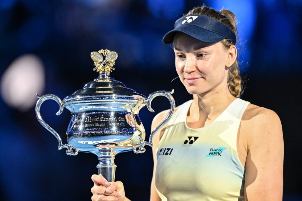 Kazakhstan's Elena Rybakina holds the Daphne Akhurst Memorial Cup after her victory against Belarus' Aryna Sabalenka during the women's singles final match on day fourteen of the Australian Open tennis tournament in Melbourne on January 31, 2026. (Photo by Izhar KHAN / AFP) / --