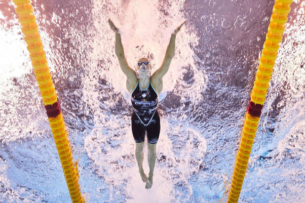 Short-course swimming race showing underwater turns at World Aquatics Championships