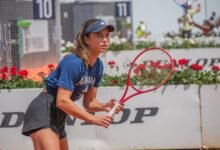 Iva Jovic preparing to receive on court in Rome, May 7, 2026