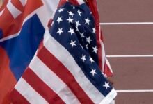 Jasmine Jones wrapped in the US flag at the 2025 World Athletics Championships