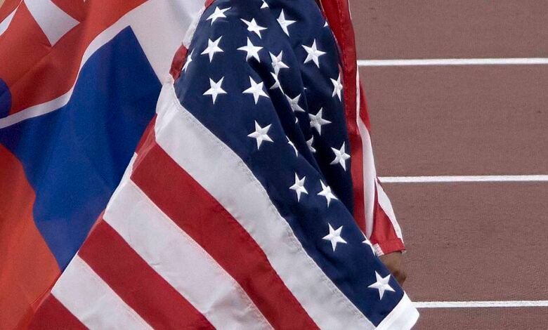 Jasmine Jones wrapped in the US flag at the 2025 World Athletics Championships